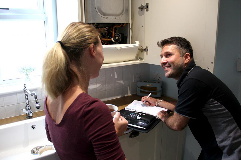 An expert boiler service engineer from Boiler Bunny Heating doing a routine gas boiler service in a house in South London - Dulwich, SE21.